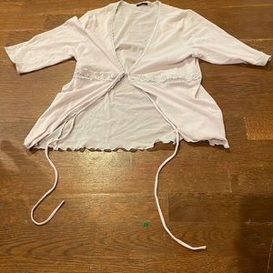 See-through material with very detailed lacing cute is a light pink